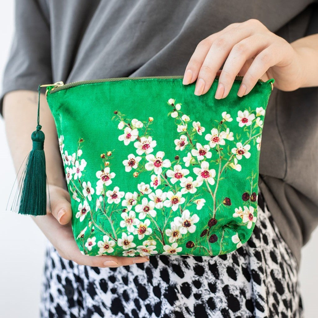 Manuka Flower Velvet Cosmetic Bag held in hand