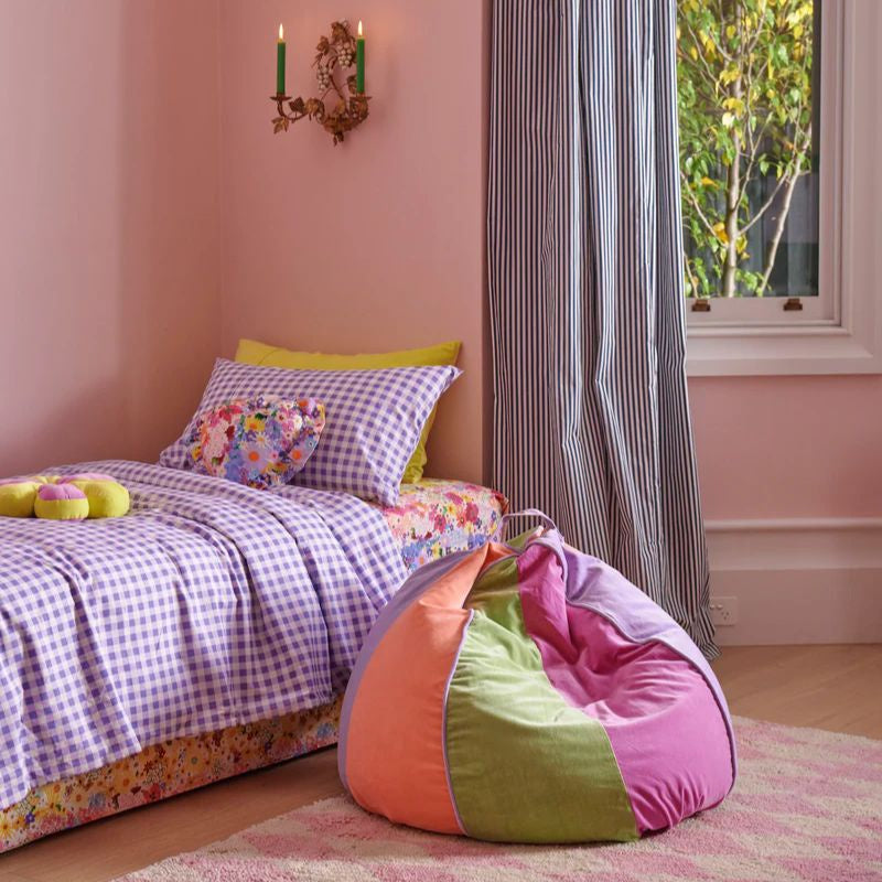 Discover Kip & Co's Velvet Beanbag at Cove. Luxurious, eco-friendly comfort! The image shows a plush, vibrant velvet beanbag in a cozy living room setting, inviting relaxation and style.