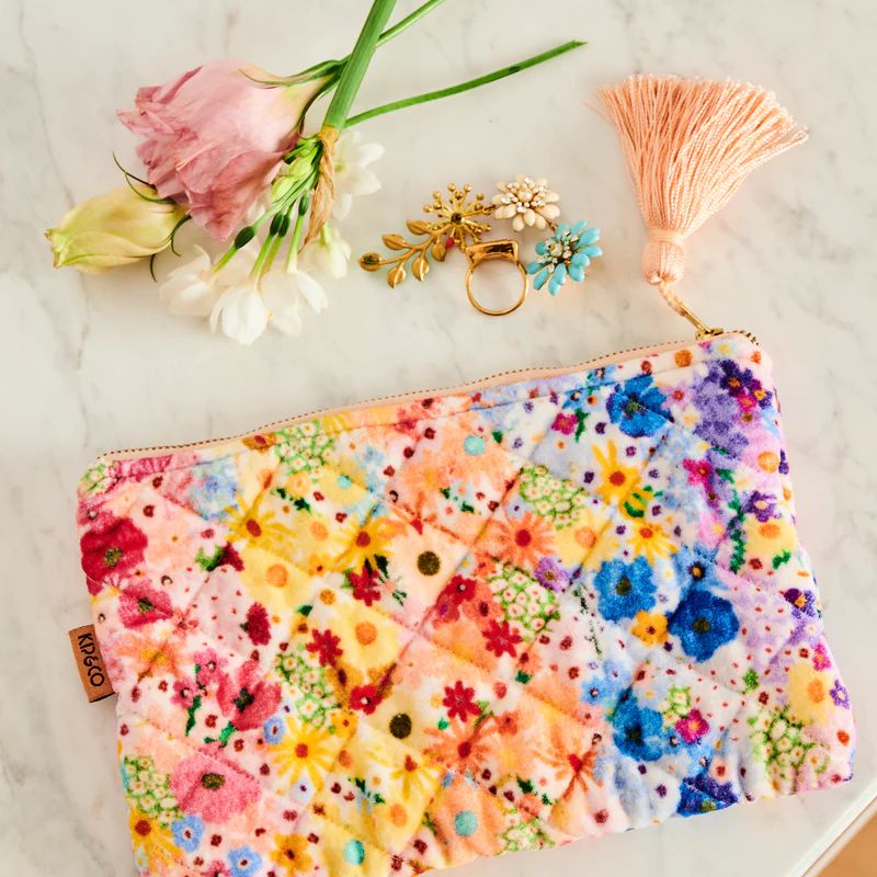 Shop the Kip & Co Posie Lane Velvet Purse at Cove. This eco-friendly and chic purse features a beautiful floral design, perfect for adding a touch of elegance to any outfit.