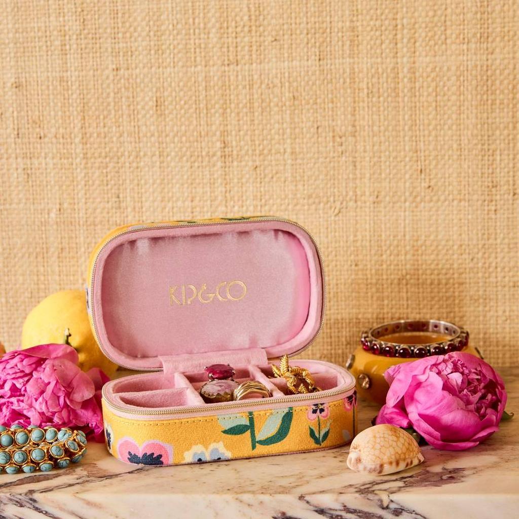 Pretty Pansy travel jewellery box open with jewellery on a styled shelf
