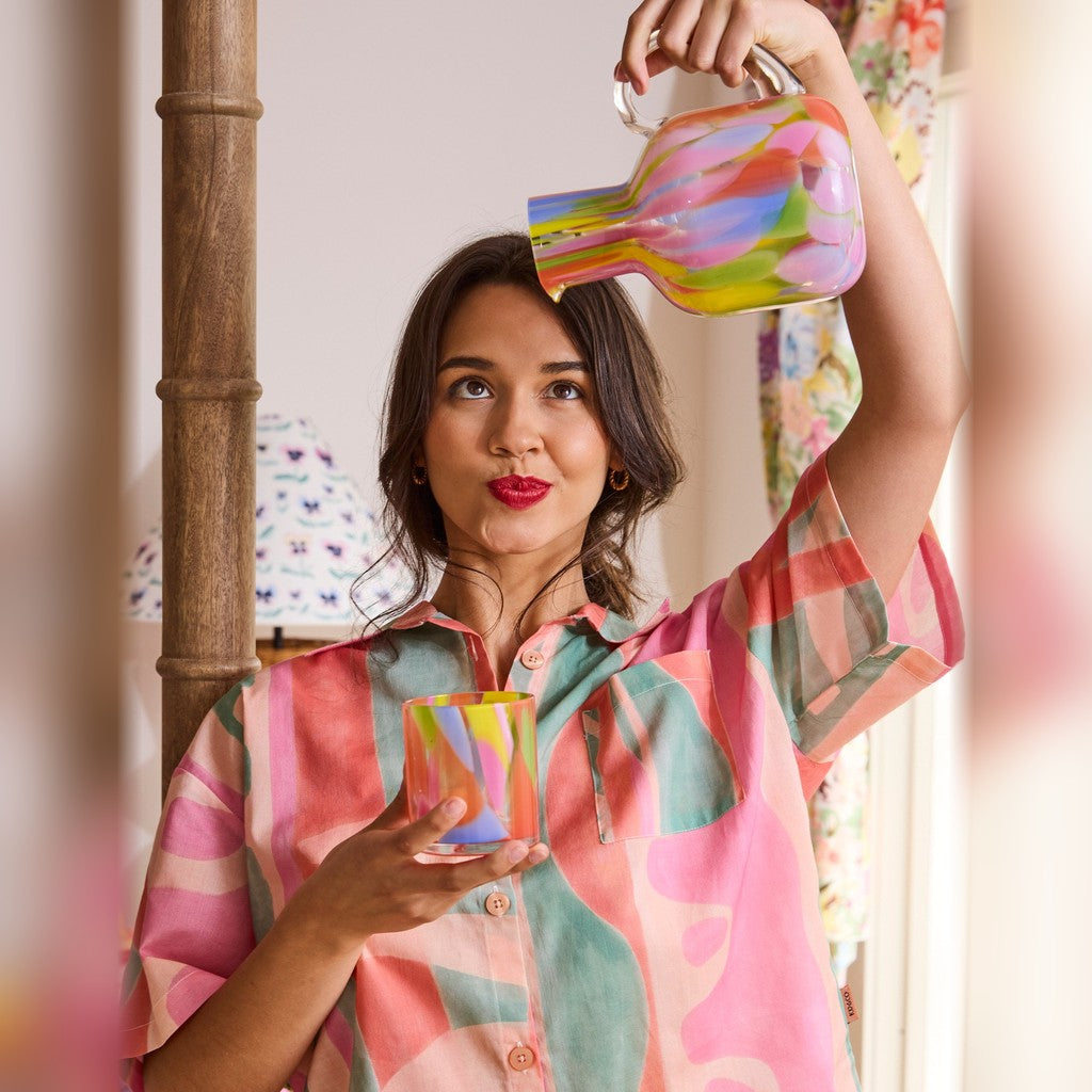 Woman pouring from the Kip & Co Festiva Carafe & Glass