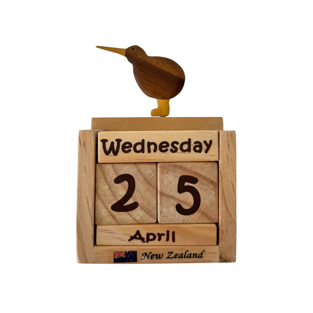 Wooden kiwi perpetual calendar showing Wednesday 25 April