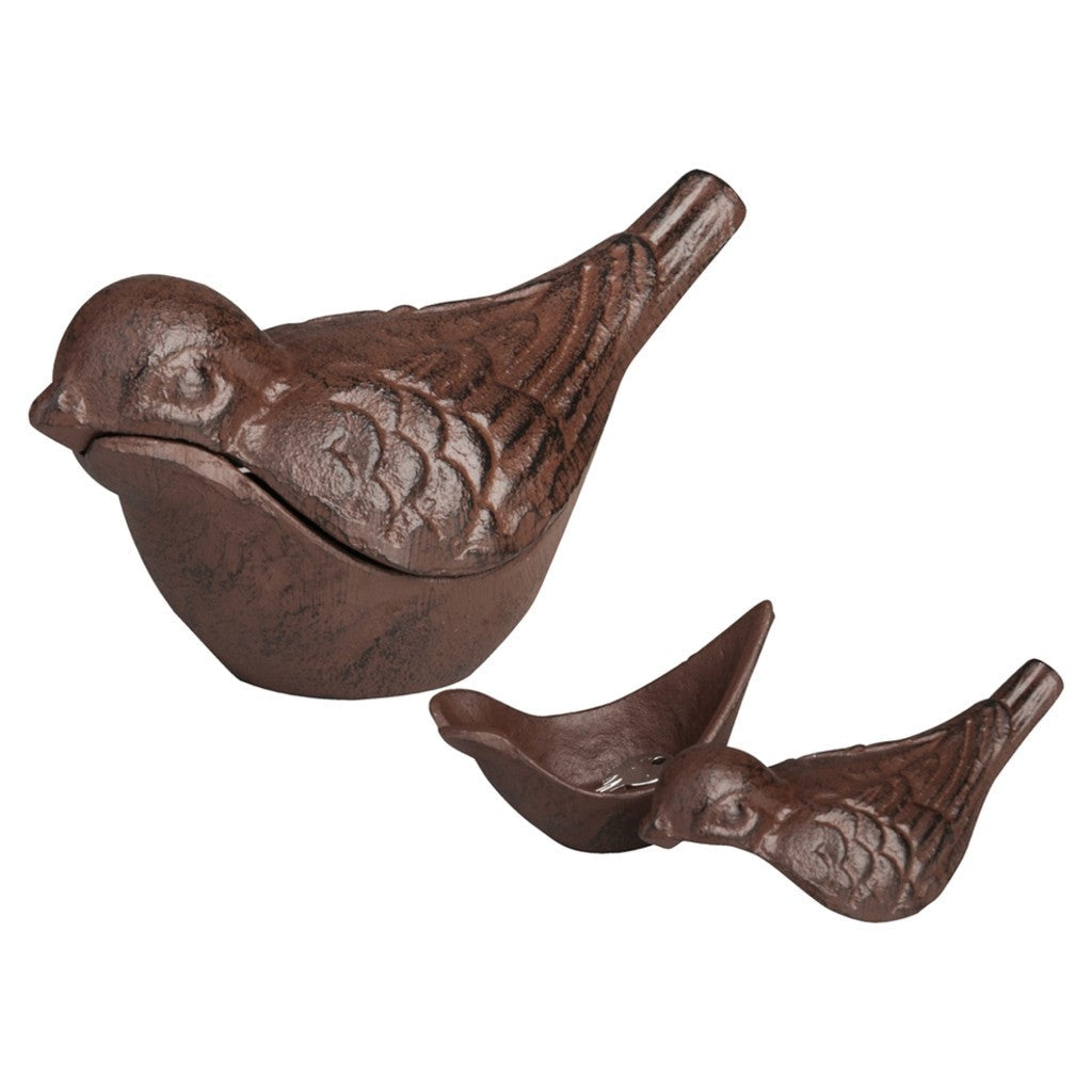 Cast iron bird ornaments on white