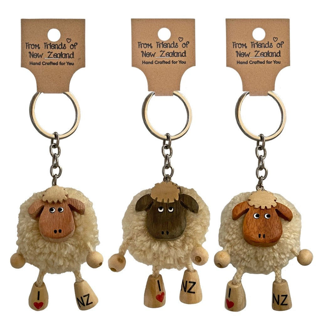 Three pompom sheep keyrings on their gift cards