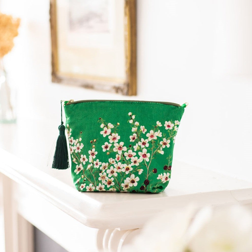 Manuka Flower Velvet Cosmetic Bag on a shelf