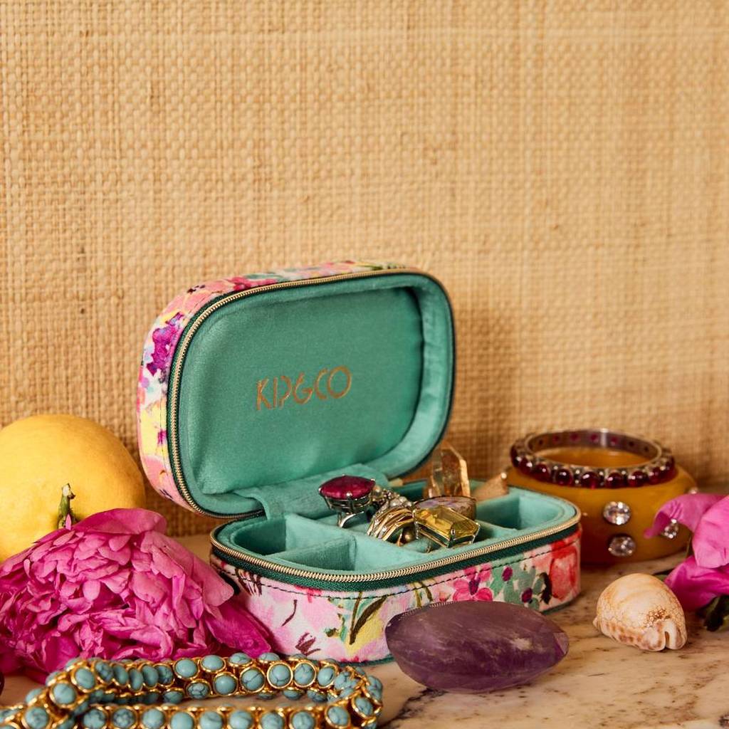Alfresco travel jewellery box open with rings and necklaces on a styled shelf