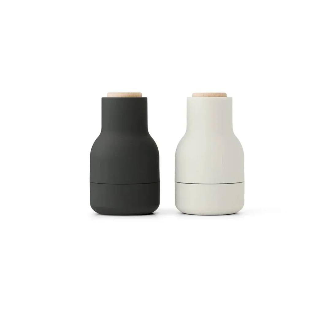 Audo Salt and Pepper Shakers: Stylish bottle-shaped grinders with ceramic mills, available in various colors for modern kitchens.