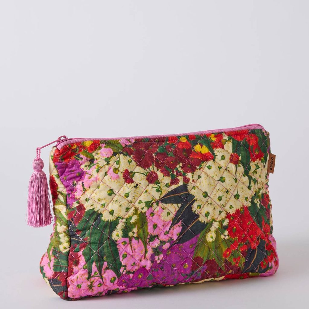 Australian Bush Blossom quilted purse, angled view on a grey background