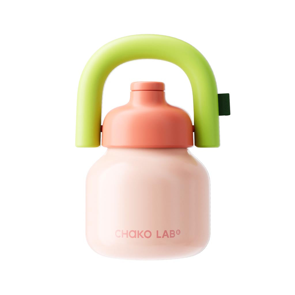 Children's water bottle with pink body, green handle, and coral cap on a white background