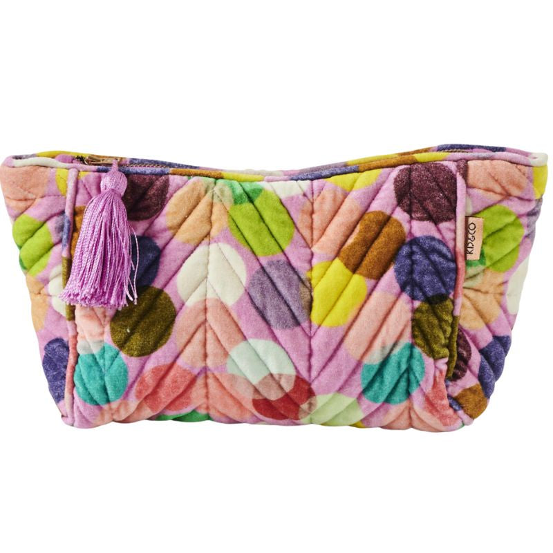 The Kip &amp; Co Confetti Pink Velvet Toiletry Bag at Cove is a stylish and eco-friendly accessory. Made from luxurious velvet, it features a vibrant confetti pink design that adds a pop of color to your travel essentials. Perfect for organizing your toiletries, this bag combines functionality with a commitment to sustainability.