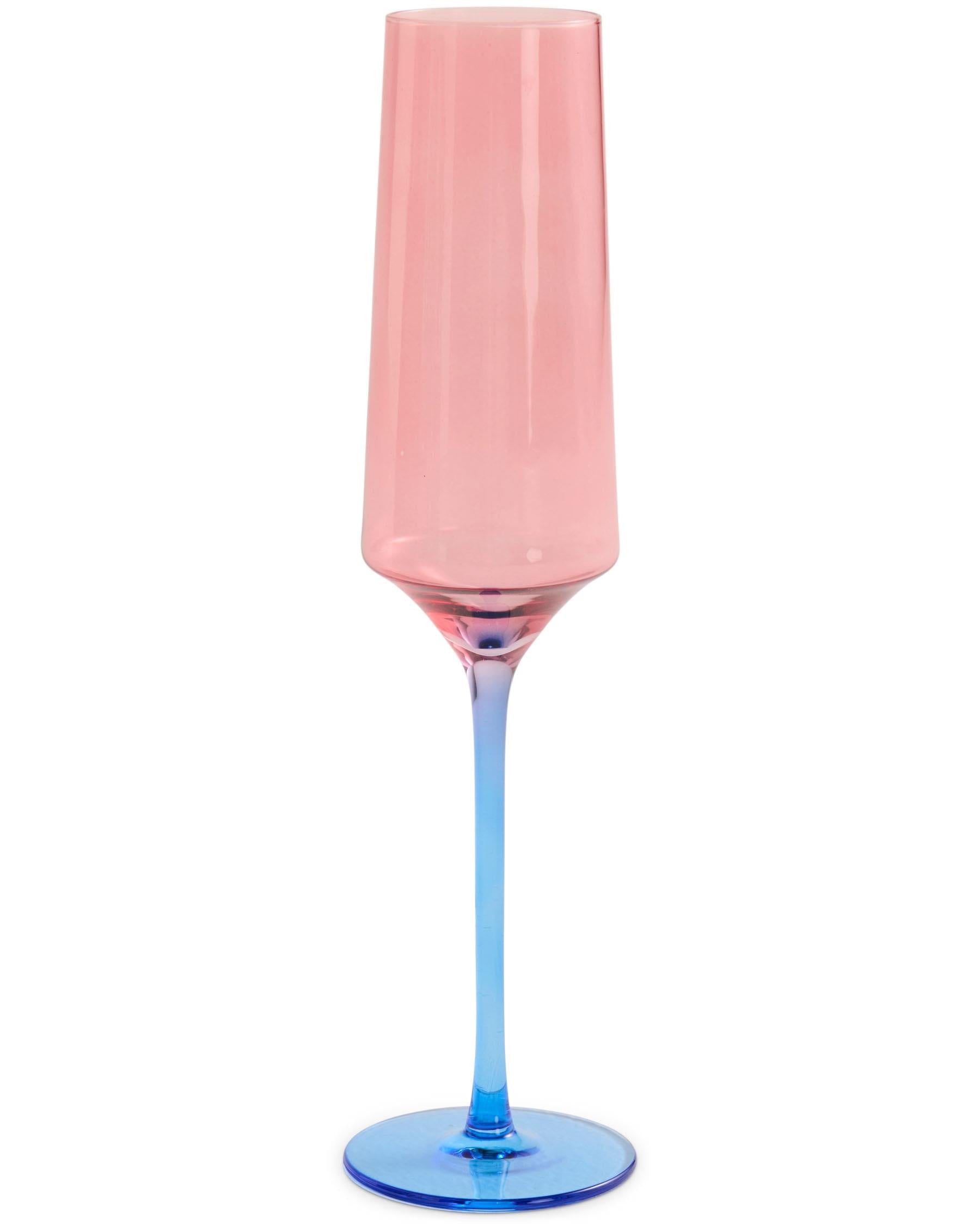 The image shows a set of two champagne glasses from Kip & Co. Each glass features a unique design with a blue robin motif. The glasses are elegantly shaped, with a slender stem and a wide, rounded bowl, perfect for serving champagne. The blue robin design adds a touch of whimsy and color to the otherwise clear glass, making them a stylish choice for special occasions or as a decorative piece. The glasses are positioned side by side against a plain background, highlighting their intricate design and craftsma