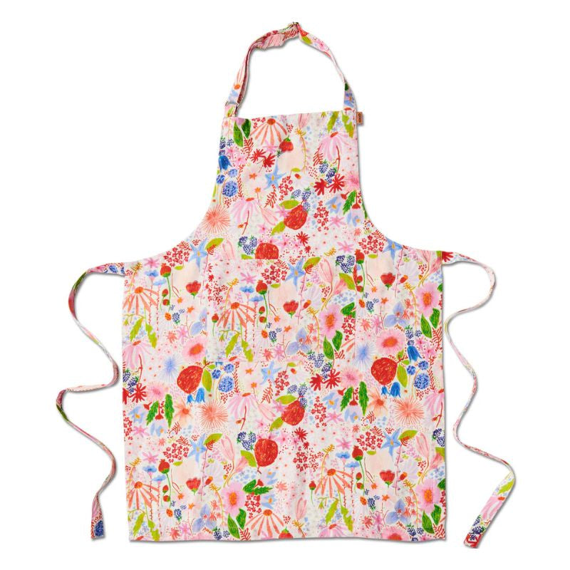 Upgrade your kitchen with Kip &amp; Co&#39;s Meandering Meadow Apron at Cove. The apron features a vibrant floral design, perfect for adding a touch of style to your cooking routine.