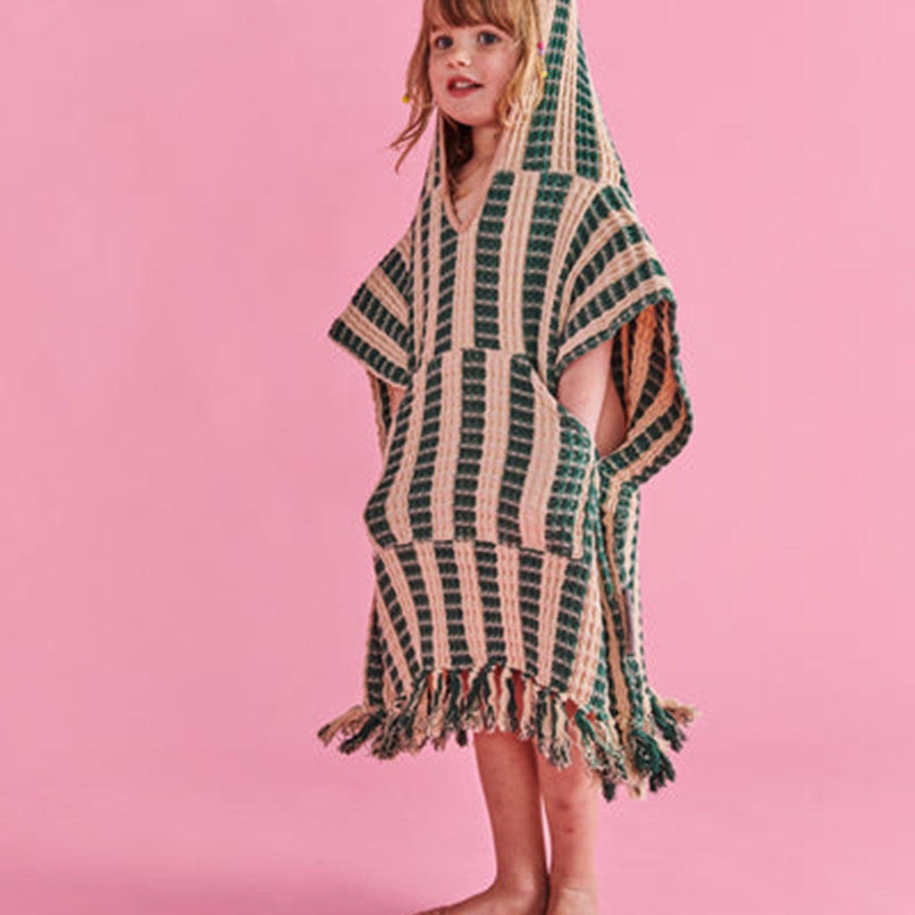 Explore the Kip &amp; Co Folklore Kids Waffle Poncho available at Cove! Made from 100% organic cotton, this poncho offers comfort and style for your little ones.