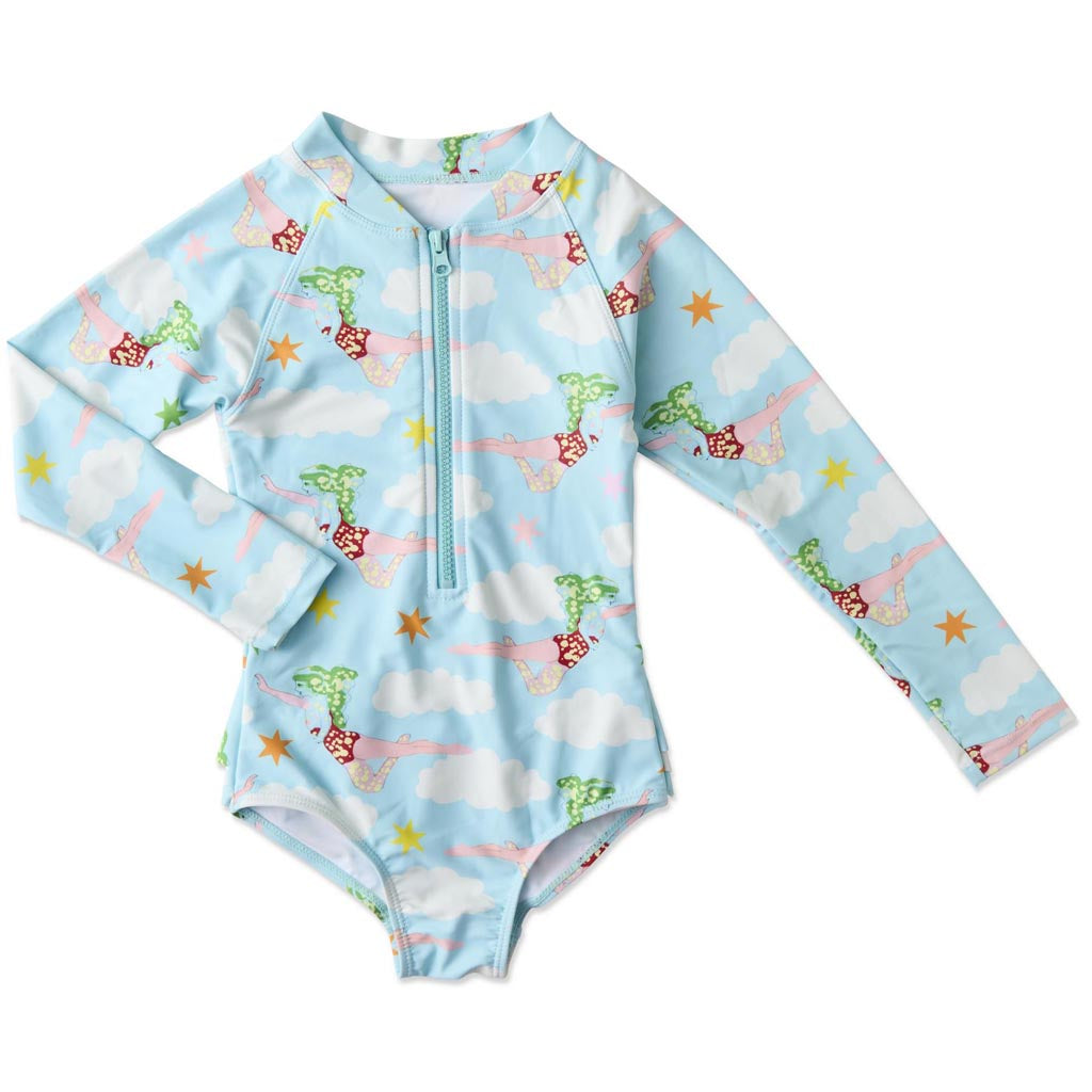 The image is of a long-sleeve bathing suit designed in collaboration between Kip & Co and The Beatles. The design is inspired by the song "Lucy In The Sky With Diamonds." The bathing suit features vibrant, psychedelic patterns and colors reminiscent of the 1960s, with abstract and whimsical elements that capture the essence of the song's imaginative and dreamlike quality. The overall look is colorful and eye-catching, suitable for someone who appreciates both fashion and music history.