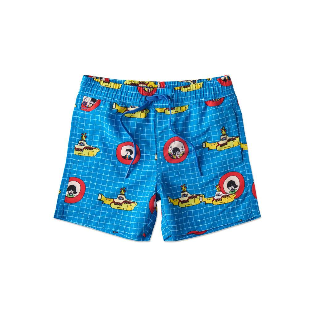The image shows a pair of colorful board shorts designed in collaboration between Kip & Co and The Beatles, featuring a "Yellow Submarine" theme. The shorts are vibrant and eye-catching, with a pattern that includes illustrations inspired by the iconic Beatles song and animated film. The design likely incorporates elements such as submarines, sea creatures, and psychedelic patterns, reflecting the whimsical and imaginative style associated with the "Yellow Submarine" artwork.