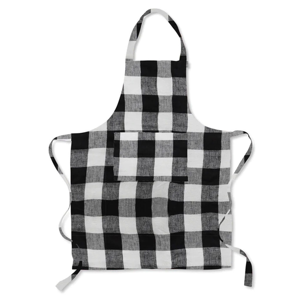 A black and white gingham linen apron with a front pocket, displayed against a white background.