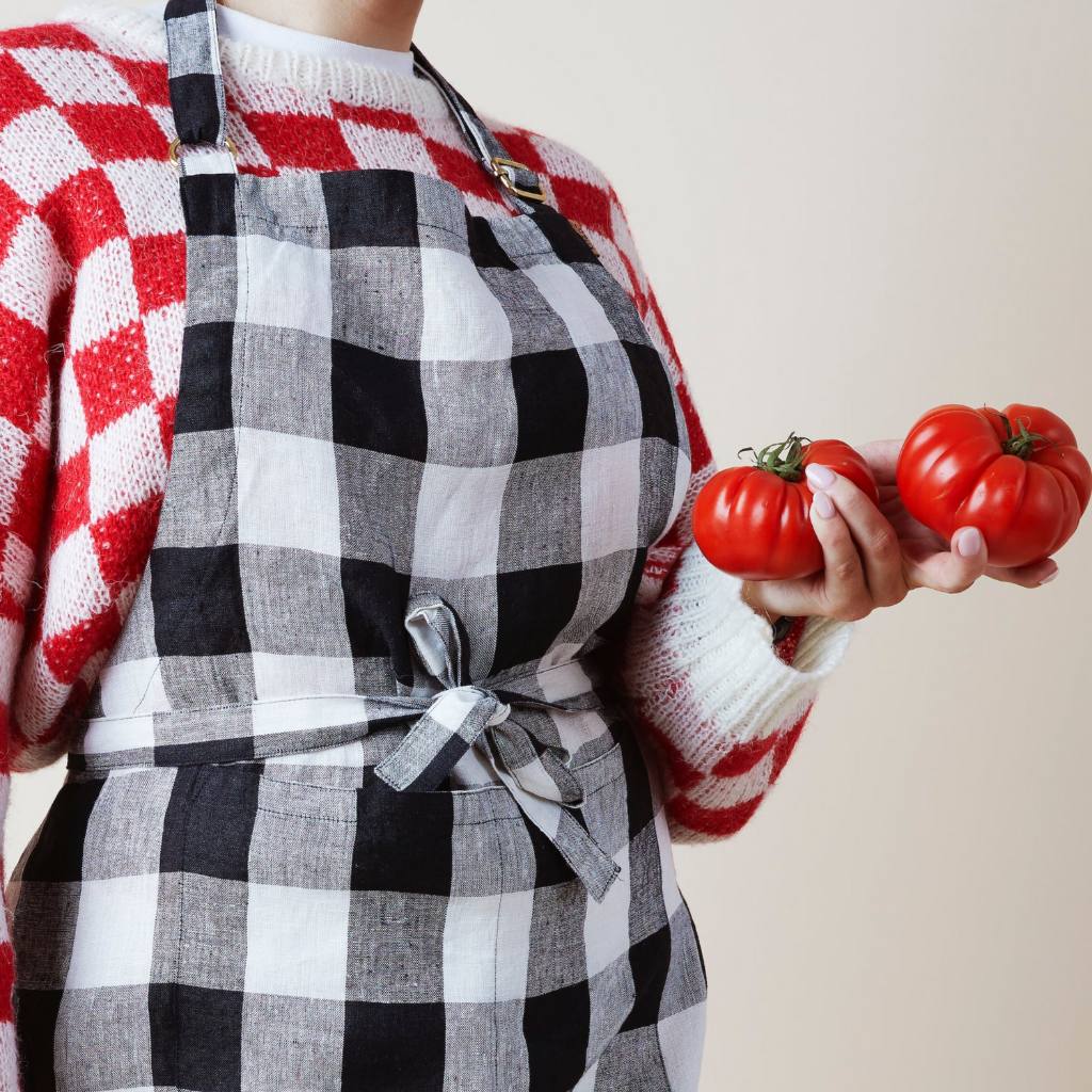 Upgrade your kitchen with Kip &amp; Co&#39;s Gingham Linen Apron available at Cove. This apron combines chic style with timeless design, making it a perfect addition to any kitchen.
