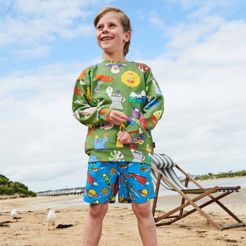 Shop Kip & Co Outer Space Boardies at Cove! These quick-dry shorts are made from 100% nylon, perfect for a day at the beach or pool.