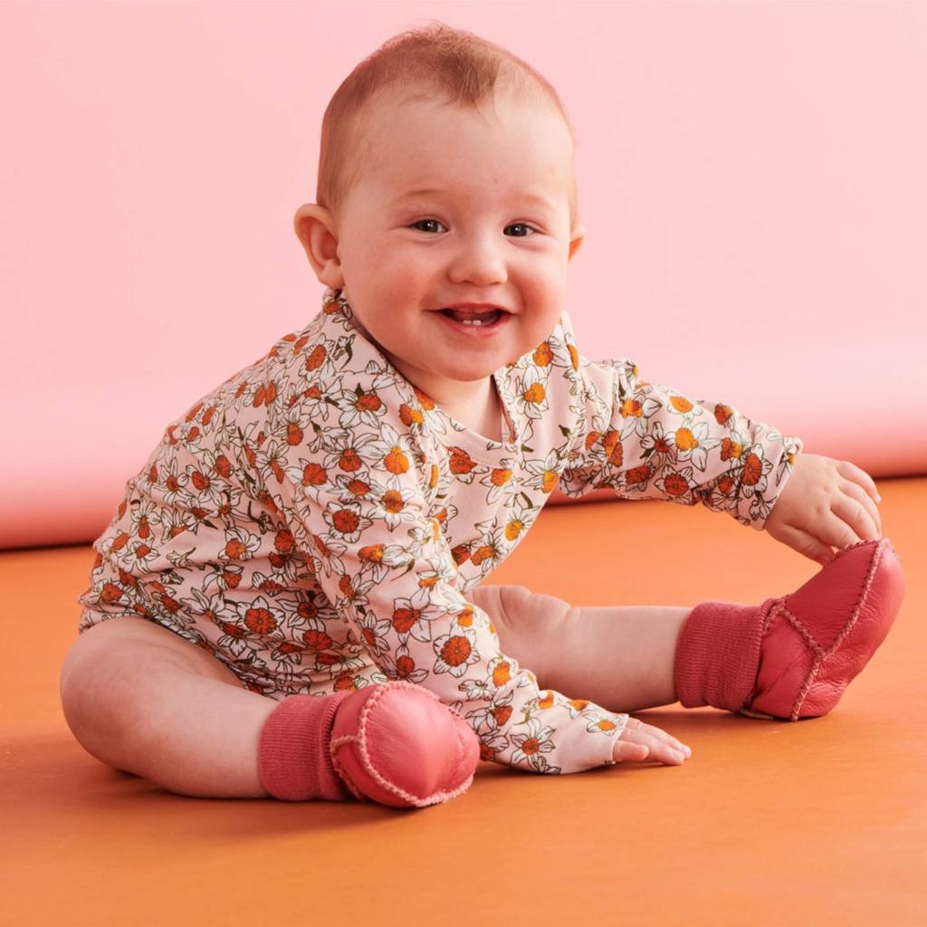 Shop Kip & Co leather baby booties at Cove. These adorable booties are made from 100% leather with a cozy merino wool inner lining, perfect for keeping your little one's feet warm and comfortable.