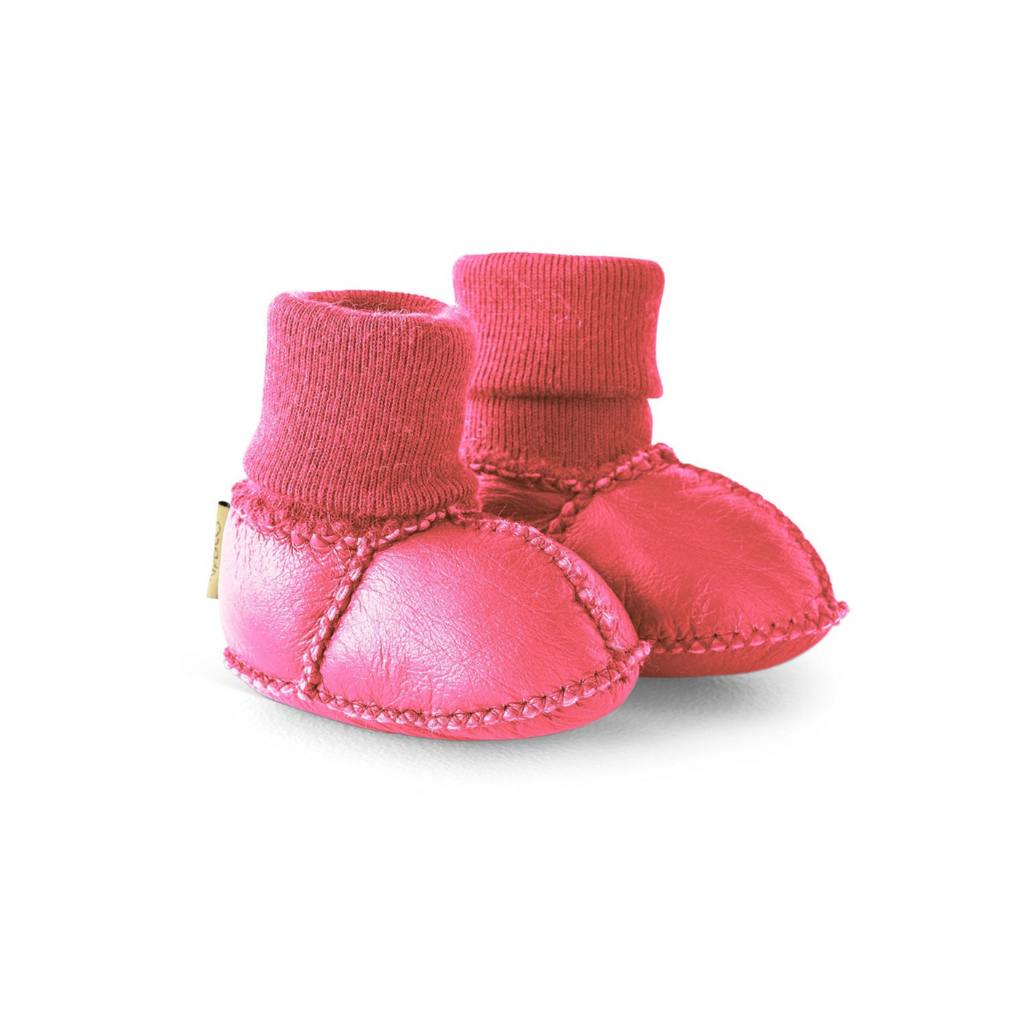 Shop Kip & Co leather baby booties at Cove. These adorable booties are made from 100% leather with a cozy merino wool inner lining, perfect for keeping your little one's feet warm and comfortable.
