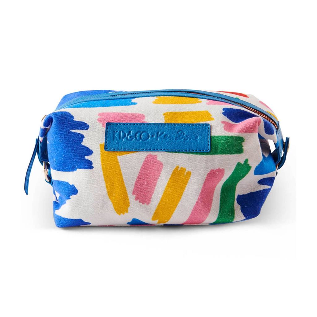 Discover the Kip &amp; Co x Ken Done Toiletry Bag at Cove, featuring vibrant sailboat prints that add a splash of color and style to your travel essentials. Perfect for organizing your toiletries with flair!