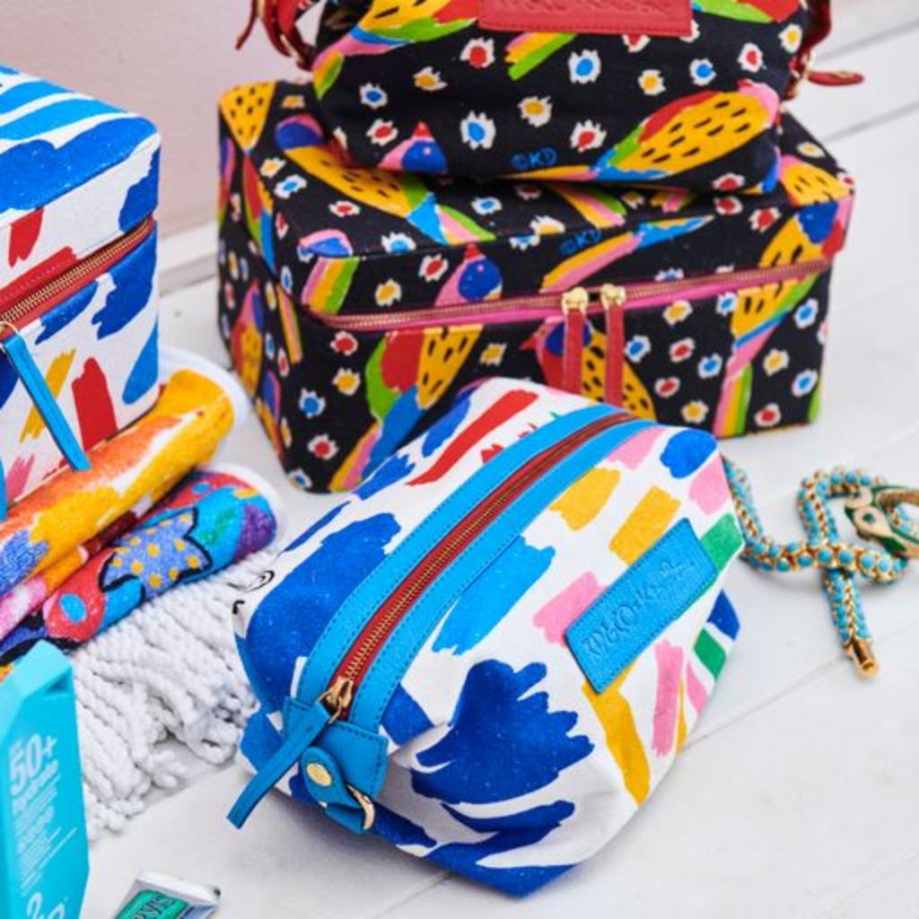 Discover the Kip & Co x Ken Done Toiletry Bag at Cove, featuring vibrant sailboat prints that add a splash of color and style to your travel essentials. Perfect for organizing your toiletries with flair!