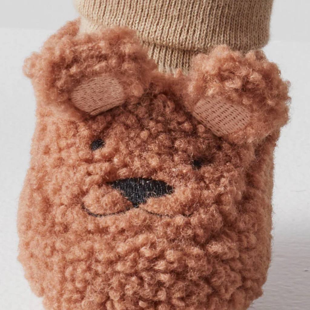 Discover Kip & Co Bear Baby Booties at Cove! These adorable booties feature a cute sherpa design and a safe grip, perfect for your little one's comfort and safety.