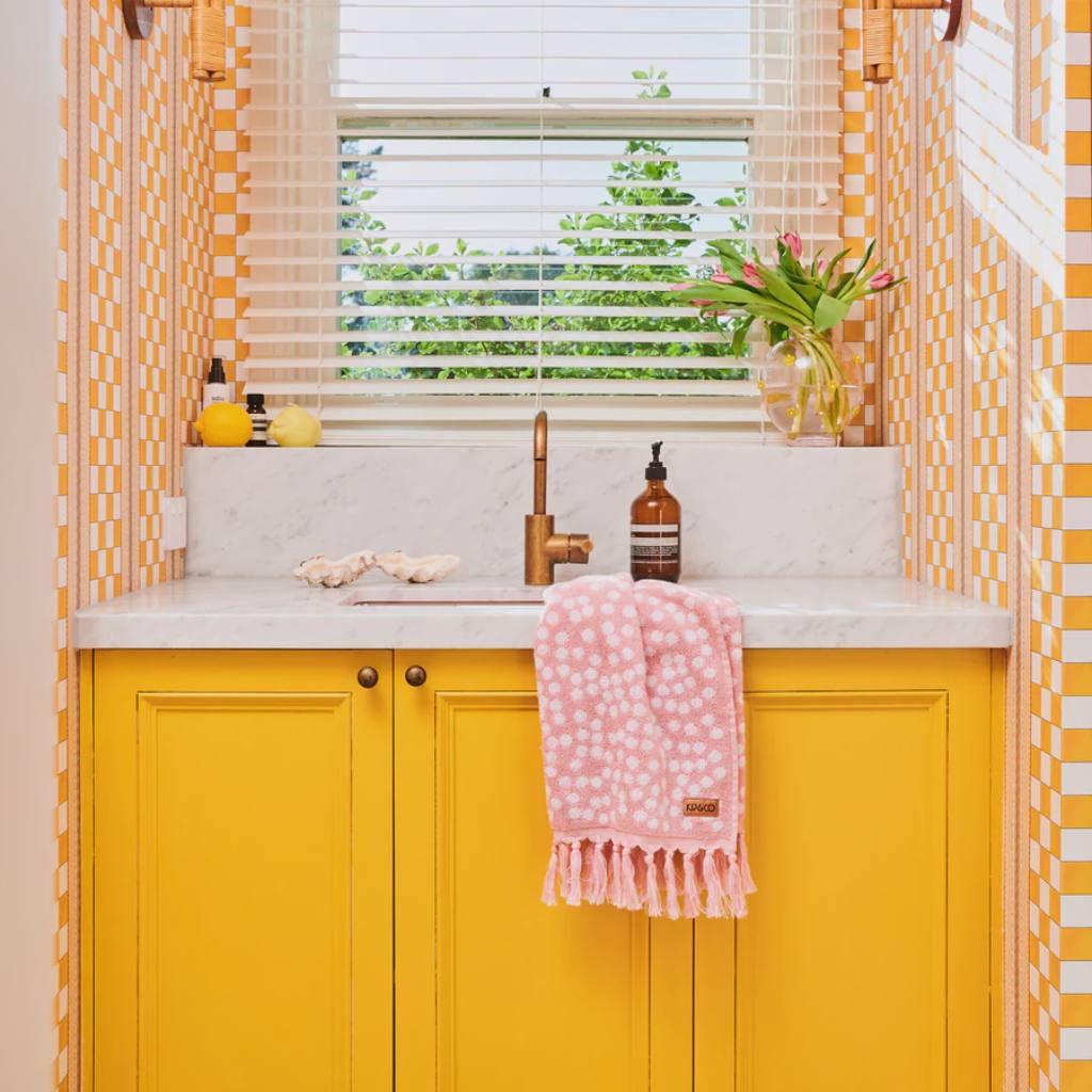 Enhance your bath experience with Kip &amp; Co&#39;s Strawberry Lamington Towel available at Cove. This stylish towel features a vibrant design inspired by the classic Australian dessert, adding a pop of color and fun to your bathroom decor. Made from high-quality materials, it offers both comfort and durability. Perfect for those who appreciate unique and playful home accessories.