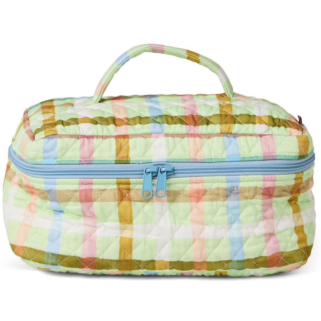 The image is of a quilted cotton toiletry case with a checkered pattern. The pattern consists of alternating squares in pastel colors, primarily mint green and pink, resembling a candy check design. The case has a zipper closure at the top and appears to be soft and padded, suitable for storing toiletries or small personal items. The overall look is playful and colorful, with a cozy, handmade feel.