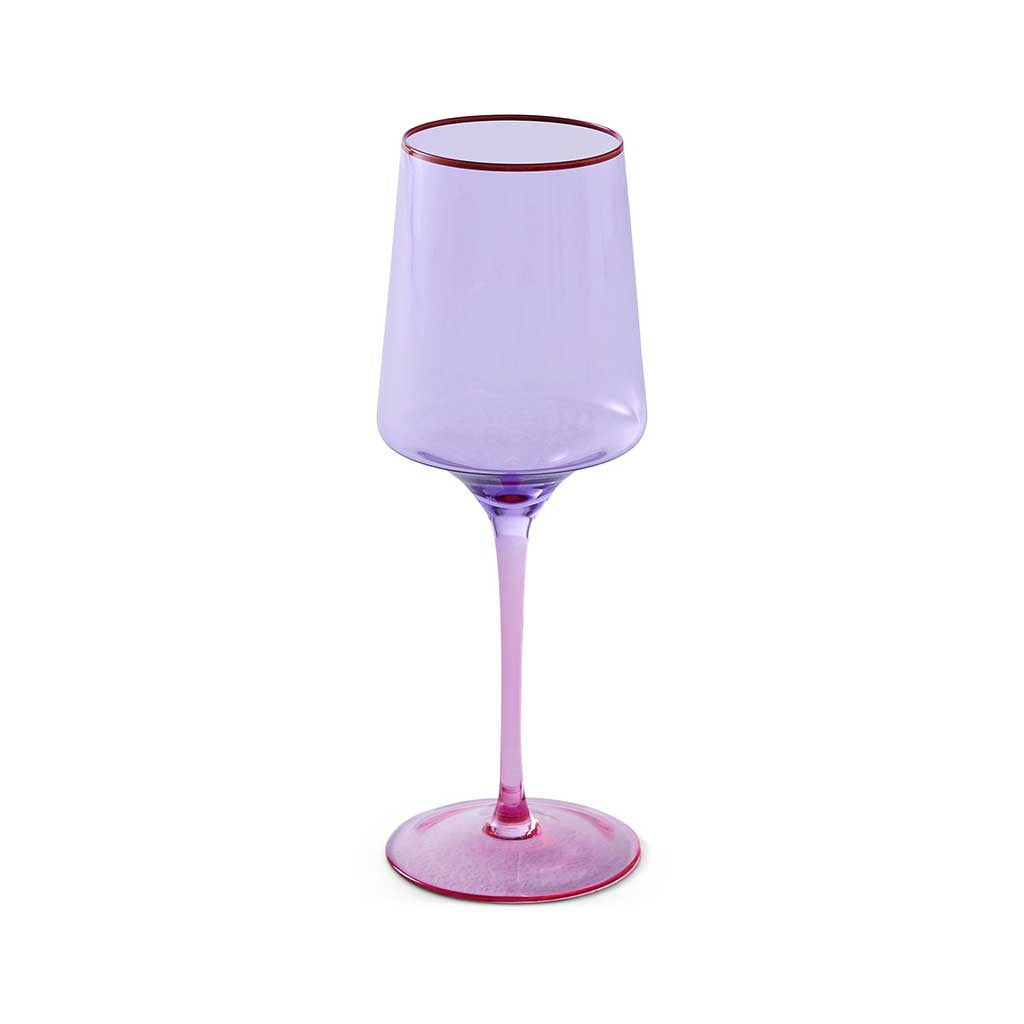 The image shows a pair of wine glasses with a unique color block design. Each glass features a lilac-colored stem and base, while the bowl of the glass is clear. The glasses are elegantly shaped, with a wide bowl that tapers slightly towards the rim. They are set against a plain, neutral background, highlighting their modern and stylish appearance.