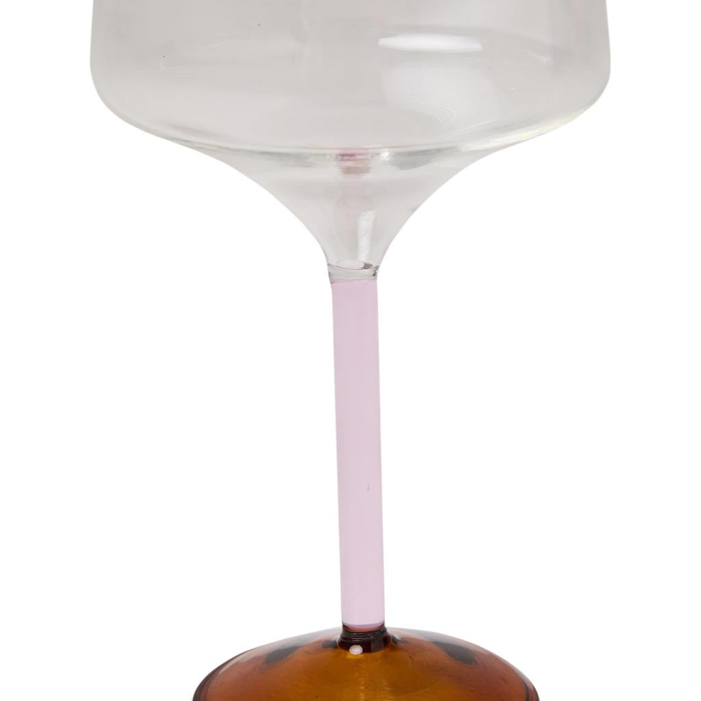 The image shows a set of two margarita glasses from Kip & Co. Each glass features a unique and colorful design, with a combination of pastel and vibrant hues resembling marshmallows and marmalade. The glasses have a classic margarita shape with a wide, shallow bowl and a short stem. They are displayed against a plain background, highlighting their artistic and playful appearance.