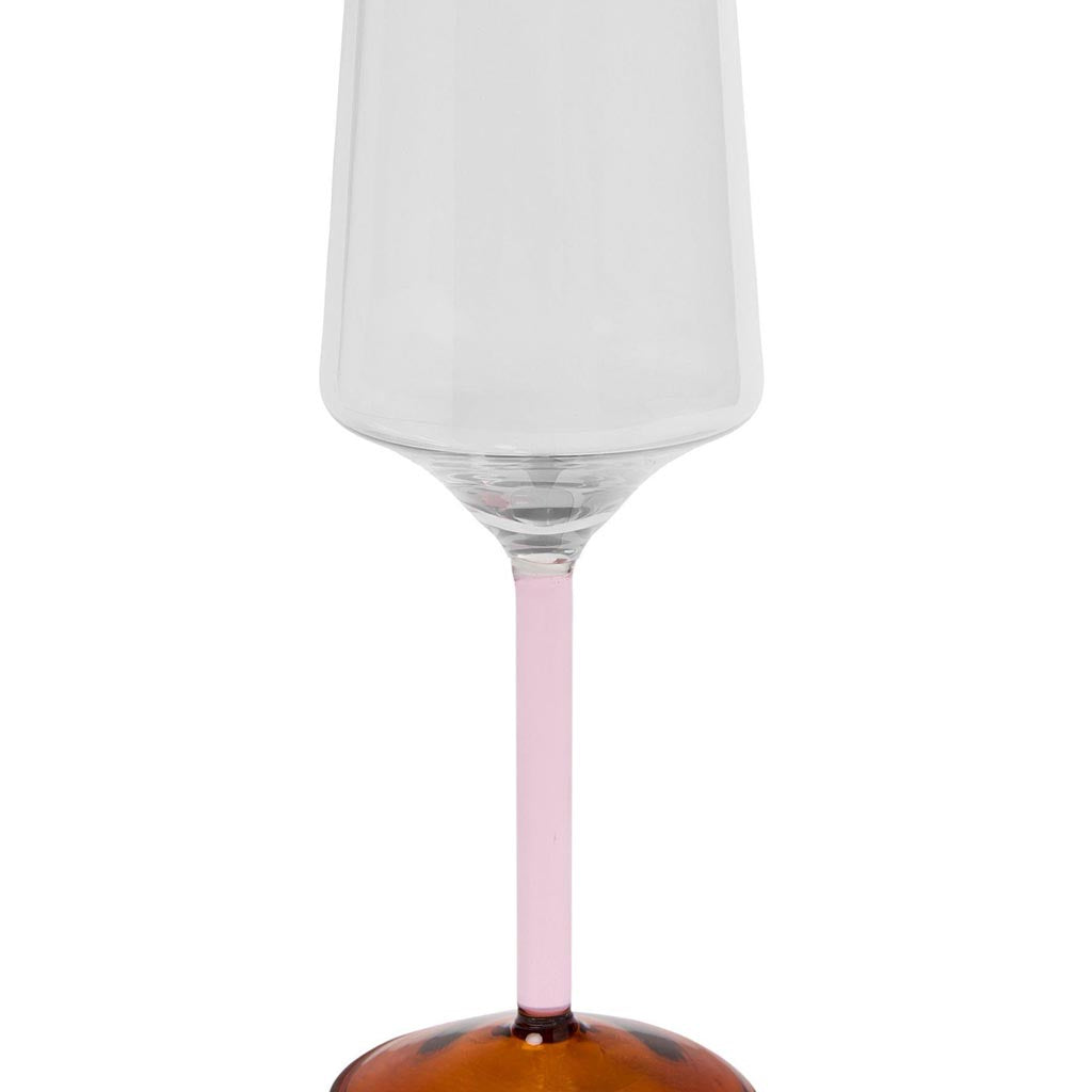 The image shows a set of two wine glasses from Kip & Co, part of their Marshmallow and Marmalade collection. The glasses are elegantly designed with a unique, colorful pattern that resembles a blend of pastel hues, reminiscent of marshmallows and marmalade. The glassware is displayed against a plain background, highlighting their artistic and vibrant design.