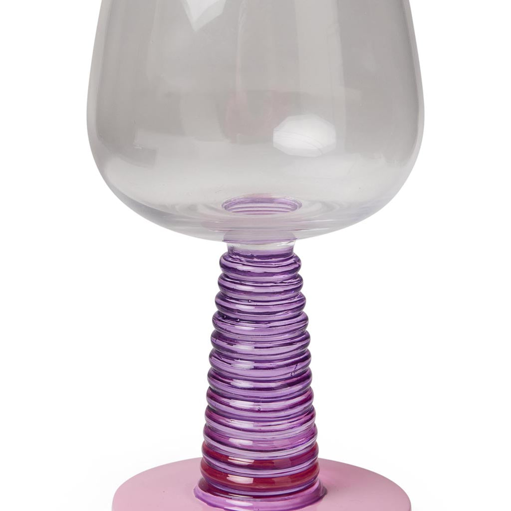 A pair of elegant wine glasses with a unique design. The glasses have a clear, smooth bowl for holding wine, and the stems are intricately designed with a textured pattern that resembles a stalk or vine. The base of each glass is sturdy, providing stability. The overall appearance is sophisticated and stylish, suitable for formal dining or special occasions. The background is plain, highlighting the beauty and craftsmanship of the wine glasses.