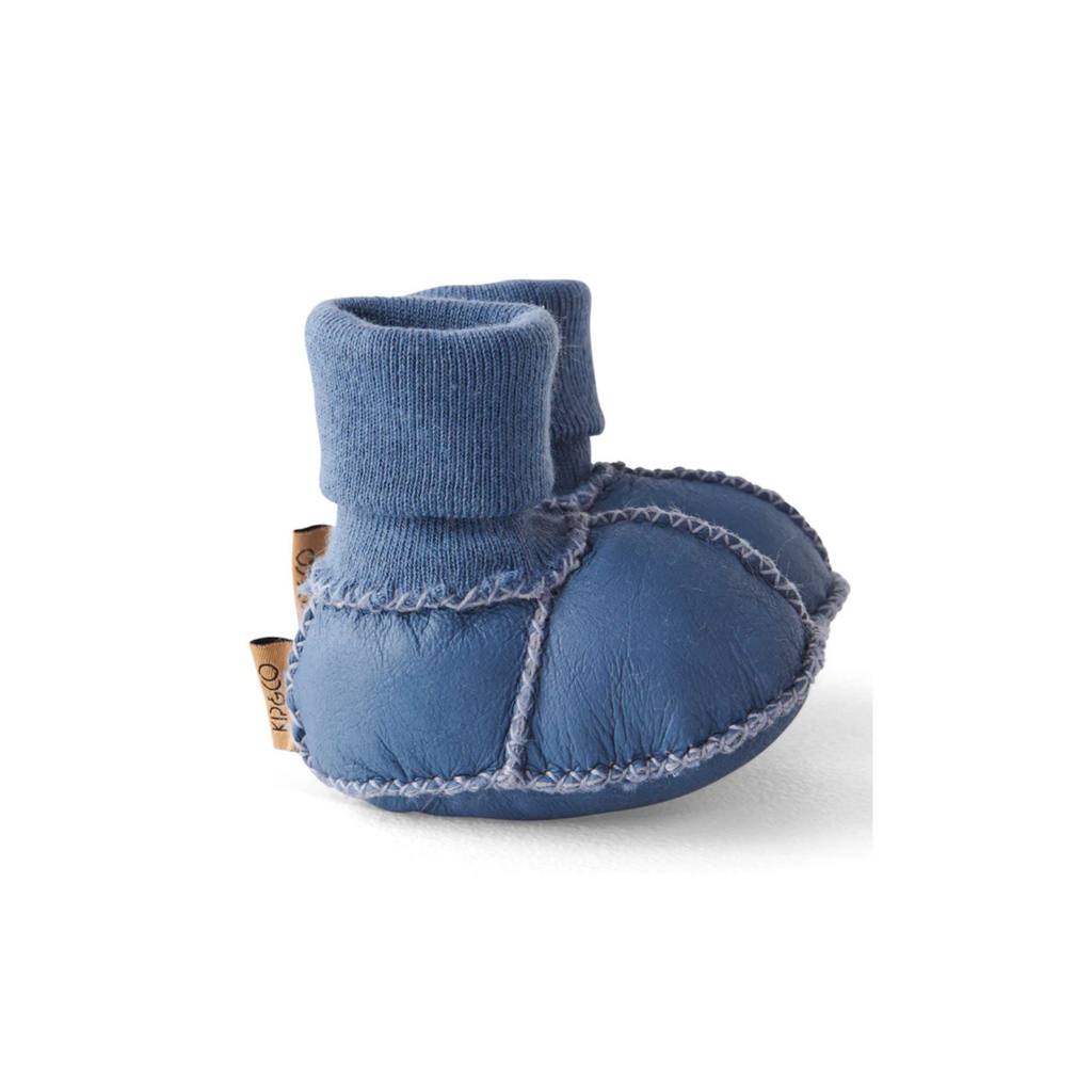 Blue baby booties with textured sole on a white background