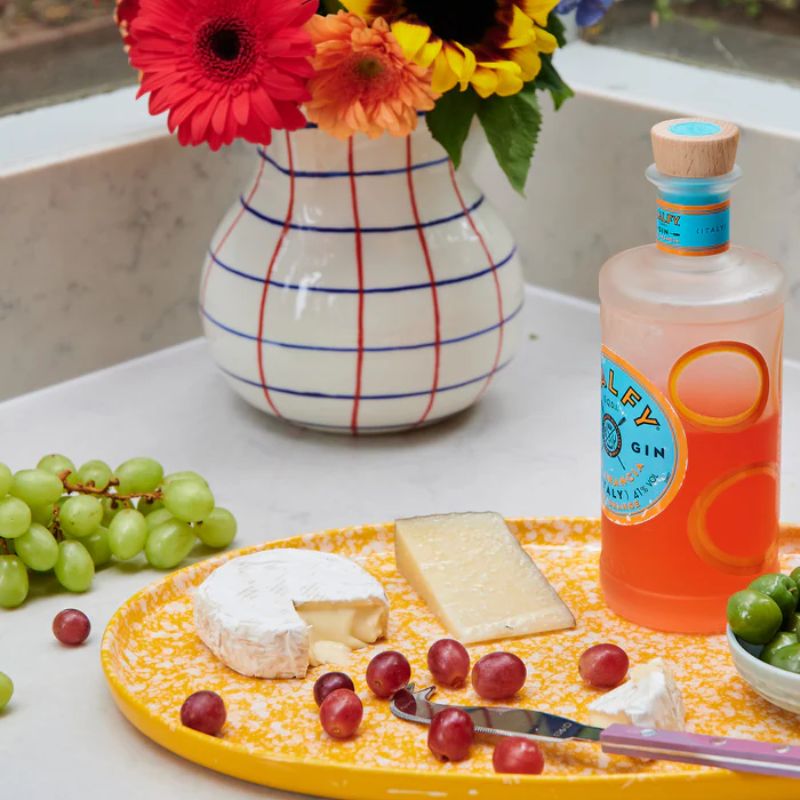 Enhance your dining experience with Kip & Co's Splat Platter, available at Cove. This vibrant platter features a striking yolk yellow ceramic design, perfect for adding a pop of color to your table setting.