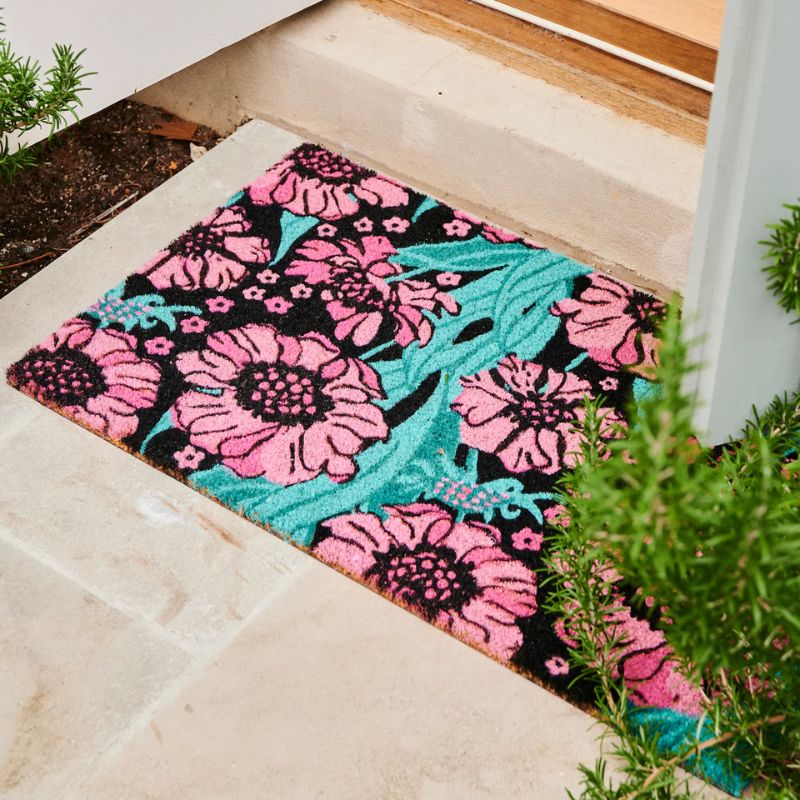 Enhance your entryway with Kip & Co's Tumbling Flowers Coir Mat from Cove. This stylish and eco-friendly mat is designed to trap dirt effectively while adding a vibrant touch to your doorstep with its beautiful floral pattern. Perfect for welcoming guests with both functionality and flair.