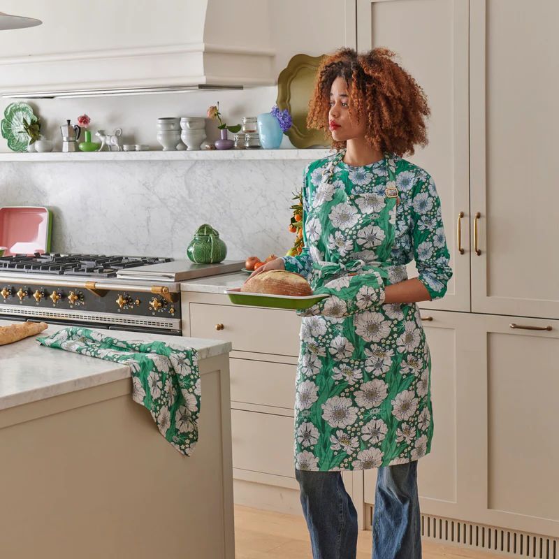 Upgrade your kitchen with Kip &amp; Co&#39;s Tumbling Flowers Apron at Cove. Made from 100% linen, this apron combines style and functionality, perfect for any cooking enthusiast.
