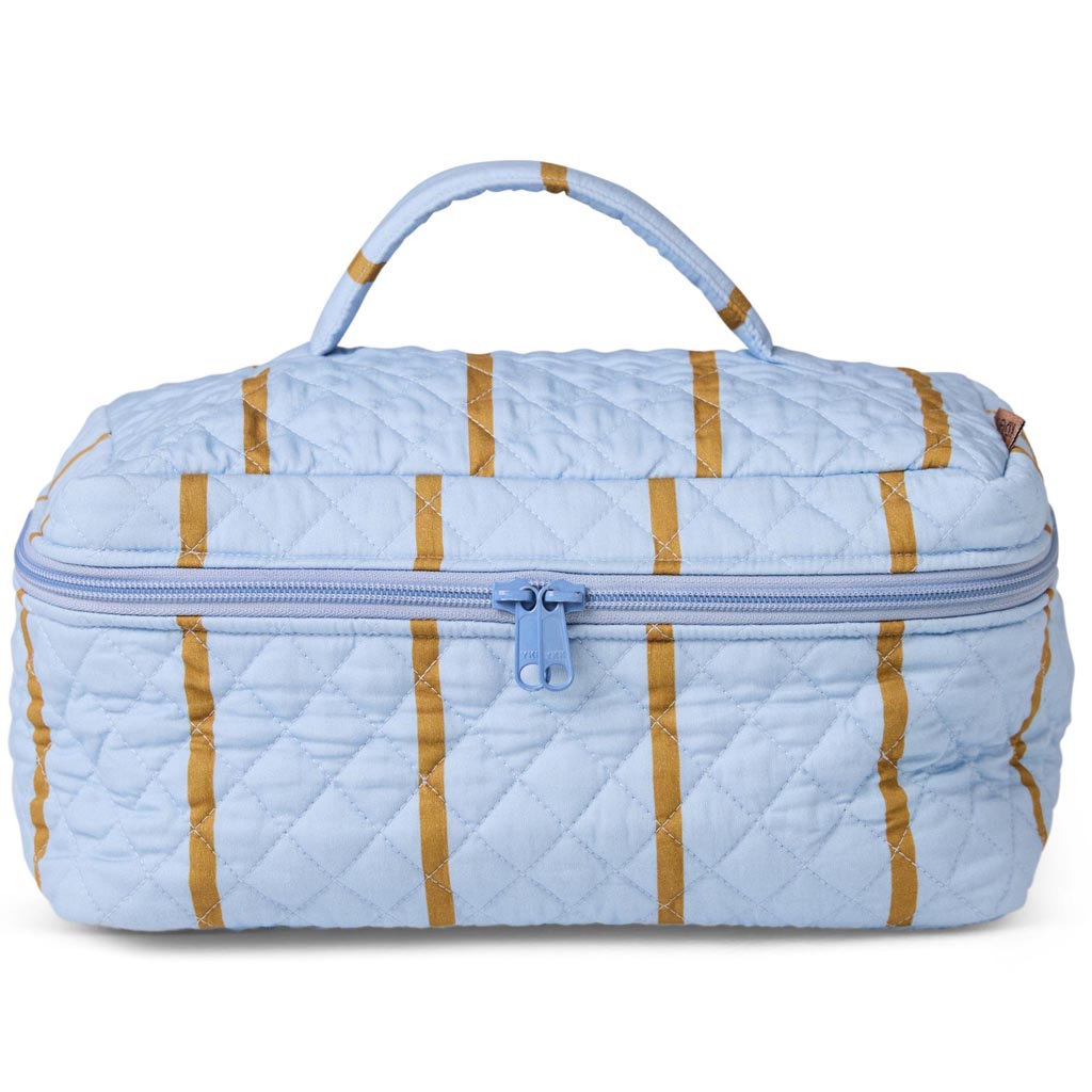 The image shows a quilted cotton toiletry case from Kip & Co. It features a colorful striped pattern with a variety of hues, including shades of pink, blue, yellow, and green. The case has a rectangular shape with a zipper closure on the top, and it appears to be padded, providing a soft and cushioned feel. The vibrant design and quilted texture give it a stylish and playful appearance, suitable for organizing toiletries or small personal items.