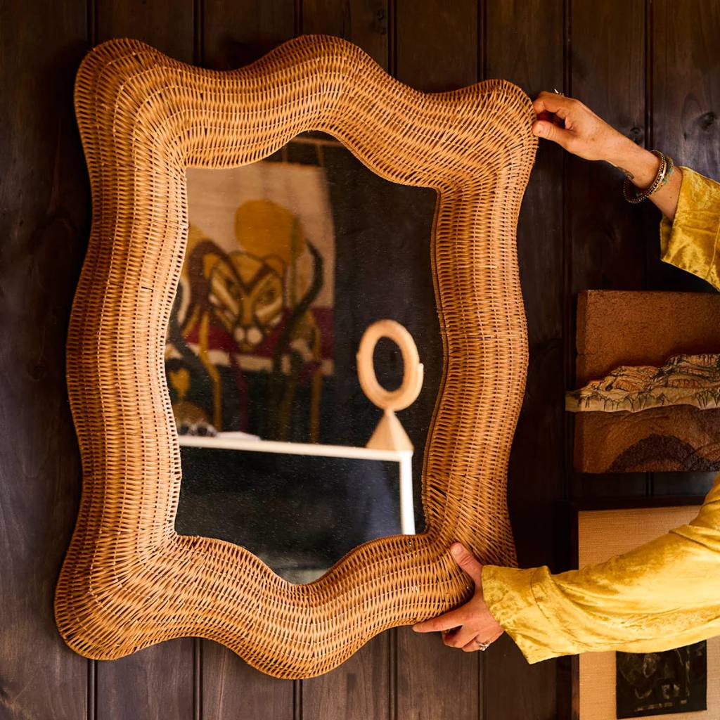 Enhance your decor with the Kip & Co Genie Rattan Mirror available at Cove. This eco-friendly, boho-style mirror adds a touch of natural elegance to any space with its intricate rattan design. Perfect for creating a warm and inviting atmosphere, the mirror combines sustainability with chic aesthetics, making it a great addition to your home.