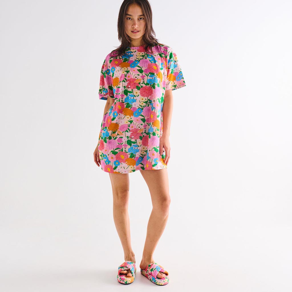 The image shows a pair of adult slippers made from quilted velvet material. The slippers are designed with a plush, luxurious texture and have a warm, cozy appearance. They are likely in a soft, pastel color, adding to their inviting and comfortable look. The slippers have a simple, slip-on style, making them easy to wear and perfect for indoor use. The quilted pattern adds a touch of elegance and sophistication to the overall design.