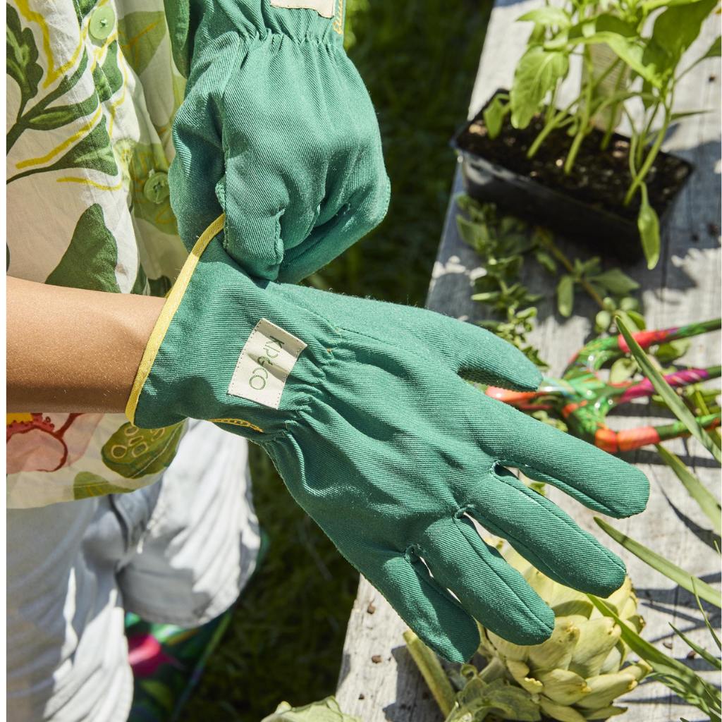 The image shows a gardening set consisting of a pair of yellow garden secateurs and matching gloves. The secateurs have a sleek design with a bright yellow handle, while the gloves are made from a durable material, also in a vibrant yellow color, with reinforced fingertips and a snug fit for comfortable use. The set is displayed on a plain background, highlighting the cheerful and coordinated design of the tools.