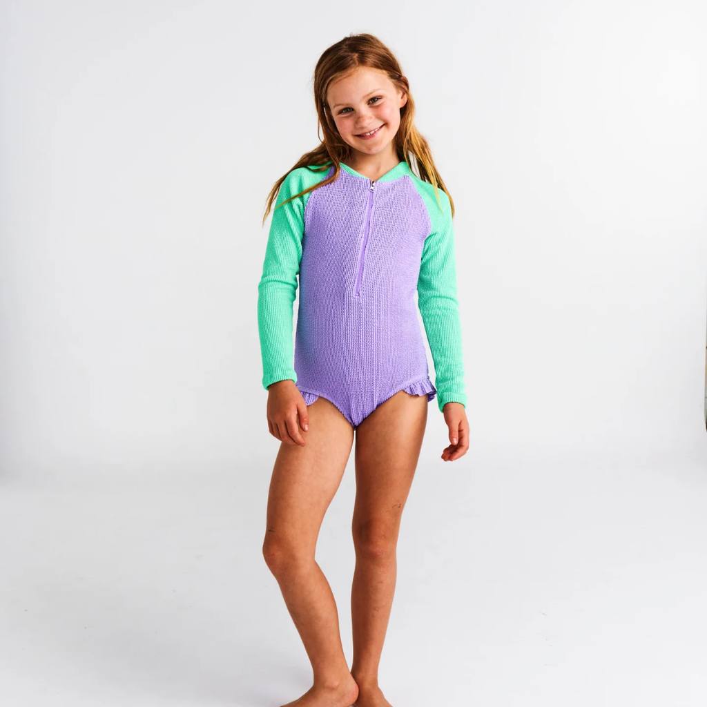 Shop Kip & Co Frutti Crinkle Bathers at Cove. These vibrant, eco-friendly bathers offer UPF 50+ protection, ensuring both style and safety in the sun!