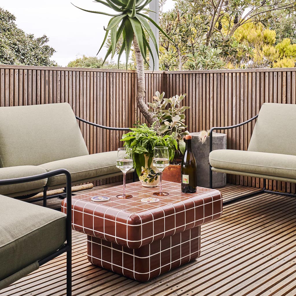 The image shows a set of two wine glasses from Kip & Co, part of their Marshmallow and Marmalade collection. The glasses are elegantly designed with a unique, artistic flair. Each glass features a colorful, abstract pattern that resembles a blend of pastel hues, reminiscent of marshmallows and marmalade. The design is vibrant and playful, adding a touch of whimsy to the classic wine glass shape. The glasses are displayed against a simple, neutral background to highlight their intricate design and vivid colo