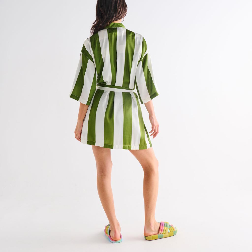 The image is of a robe made from eco-friendly satin material. The robe features a design with horizontal stripes in various shades of green, resembling moss. It has a relaxed fit with long sleeves and a belt for tying around the waist. The fabric appears smooth and shiny, typical of satin, giving it a luxurious look. The robe is displayed against a plain background, highlighting its texture and color pattern.