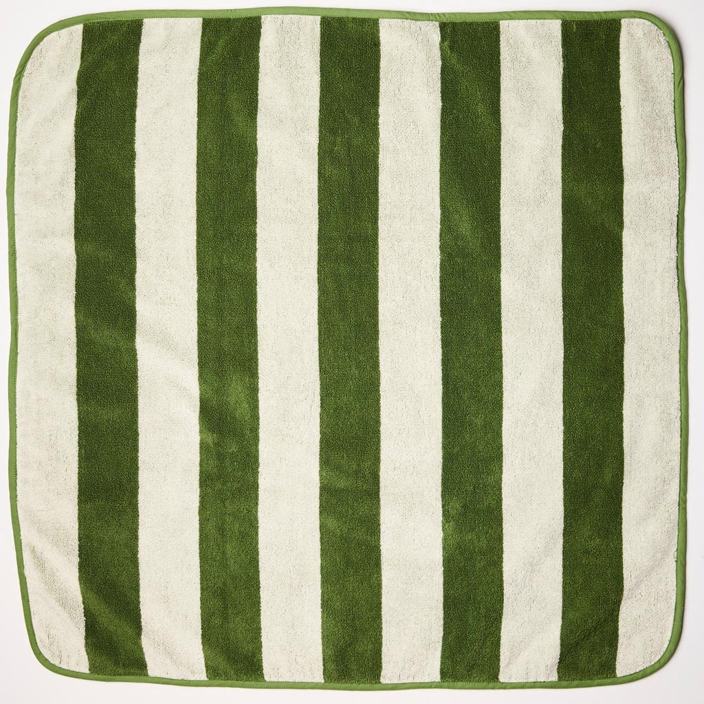 The image is of a baby towel made from terry cloth material. The towel features a striped pattern with various shades of green, resembling moss. It is designed for infants, likely soft and gentle on a baby's skin. The towel may have a hood or corner pocket to wrap around the baby's head, a common feature in baby towels for added warmth and comfort.