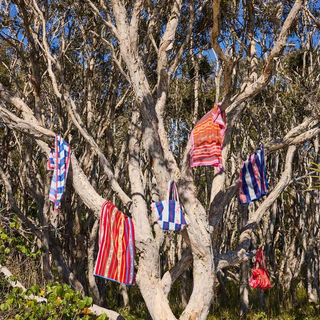 Kip & Co sarongs hanging in a coastal tree