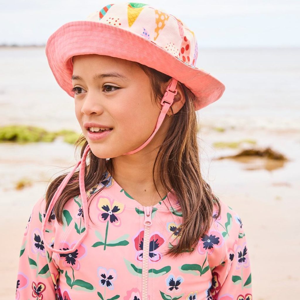 Close-up of girl in Pretty Pansy bathers and hat