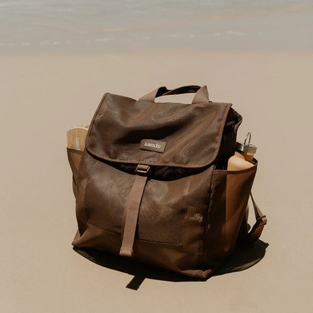 sande-kids-beach-hauler-mesh-backpack-espresso,12,SANDE mesh backpack Espresso Ð flat lay with beach essentials