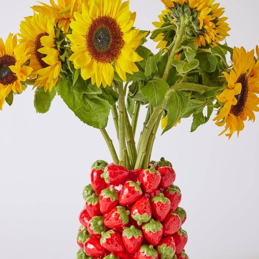 Strawberry Jam vase holding sunflowers