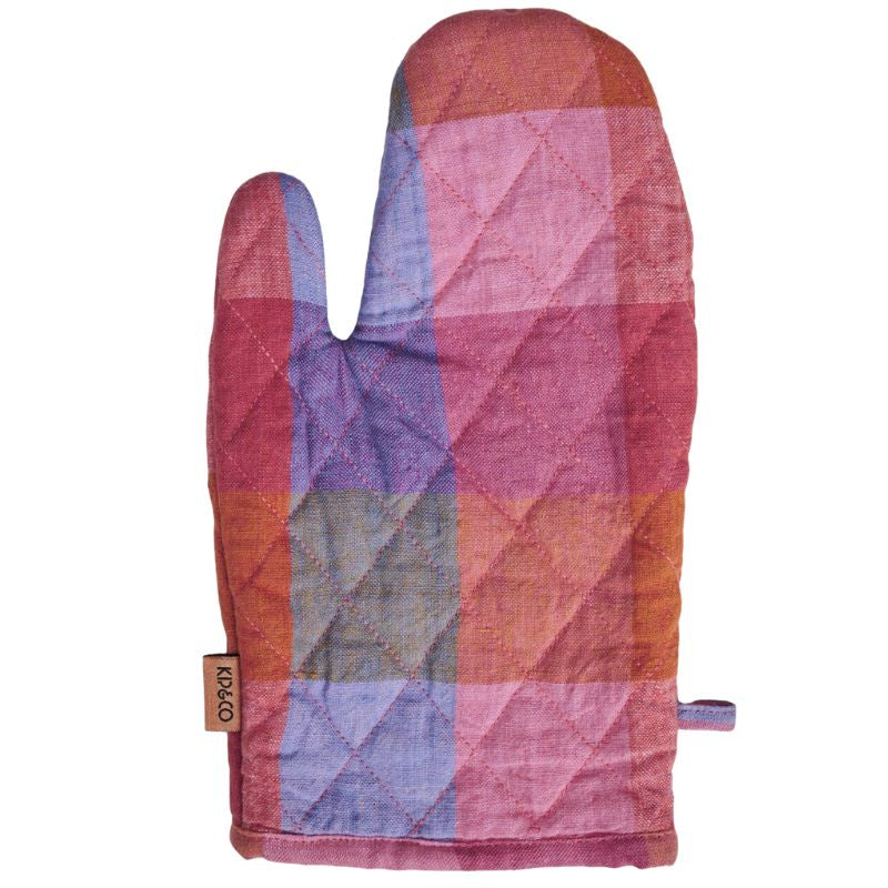 The image shows a colorful Kip &amp; Co Tutti Frutti Oven Mitt available at Cove. The oven mitt features a vibrant, playful design with various fruit patterns, made from 100% cotton for both style and safety in the kitchen.